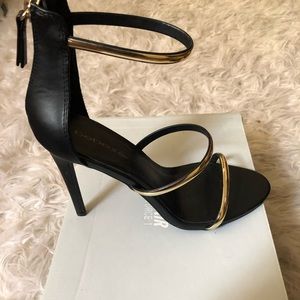 Black and gold “Berdine” heel.